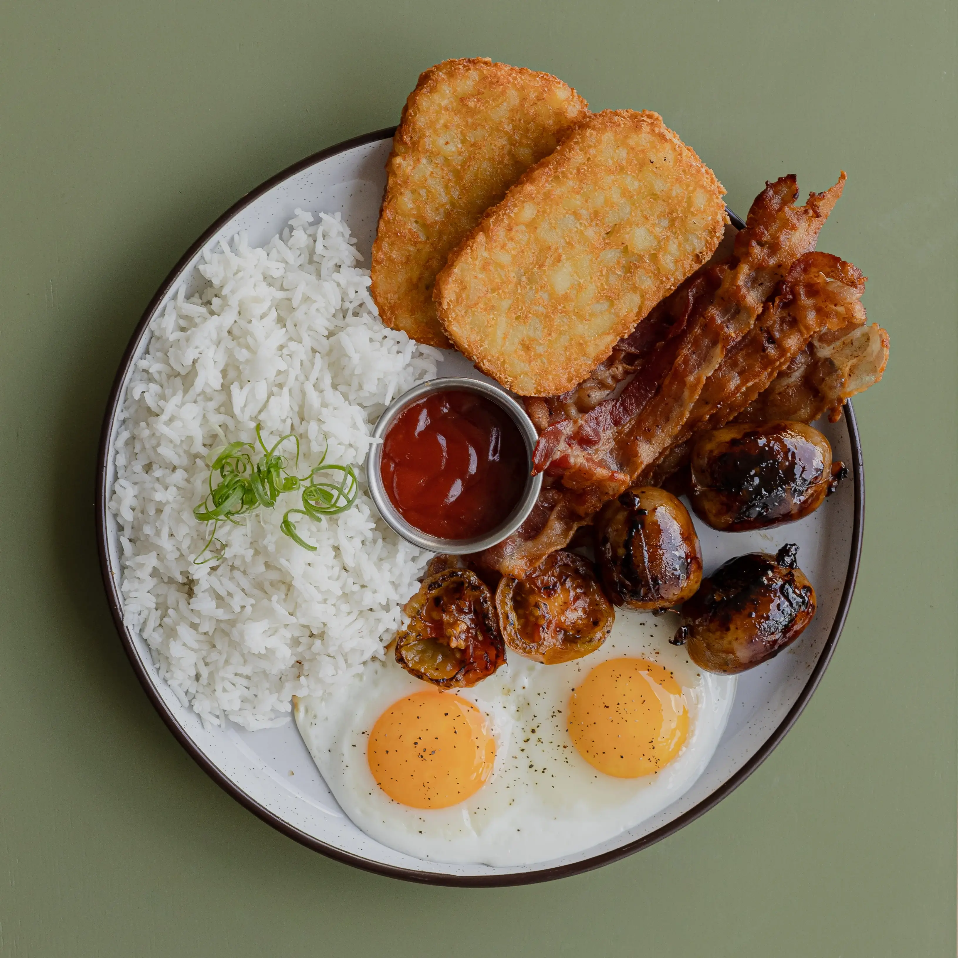 Big breakfast on rice, Cebu chorizo, potato hash, poached egss, smoked bacon